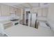 Bright kitchen features tile floors, wood cabinets, and white appliances at 1349 Goldenglow Rd, Las Vegas, NV 89108