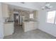 Eat-in kitchen with ample counter space, tile floors and modern appliances at 1349 Goldenglow Rd, Las Vegas, NV 89108