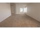Spacious living room boasts neutral carpeting, ample natural light, and a welcoming atmosphere at 1349 Goldenglow Rd, Las Vegas, NV 89108