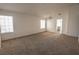 Spacious living room features plush carpeting, with bright natural lighting at 1349 Goldenglow Rd, Las Vegas, NV 89108