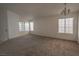 Spacious living room features plush carpeting, with bright natural lighting at 1349 Goldenglow Rd, Las Vegas, NV 89108