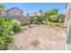 Backyard patio with brickwork, landscaping and partial view of surrounding neighborhood at 1349 Goldenglow Rd, Las Vegas, NV 89108