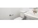 Close-up of the bathroom featuring a toilet, modern fixtures, and a clean, minimalist design at 1485 Melodic Lark Ln, Las Vegas, NV 89138
