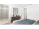 Stylish bedroom showcasing a modern design and an ensuite bathroom at 1485 Melodic Lark Ln, Las Vegas, NV 89138