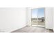 Bedroom features neutral carpet, a sliding glass door to a balcony, and lots of natural light at 1485 Melodic Lark Ln, Las Vegas, NV 89138