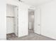 The carpeted bedroom includes an open closet with a rod for hanging clothes at 1485 Melodic Lark Ln, Las Vegas, NV 89138
