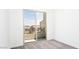 This bedroom includes a sliding glass door to the balcony with a view of the community at 1485 Melodic Lark Ln, Las Vegas, NV 89138