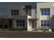 Modern two-story home featuring contemporary architecture and lush landscaping at 1485 Melodic Lark Ln, Las Vegas, NV 89138