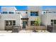 Contemporary home exterior with a covered entrance, block wall and desert landscaping at 1485 Melodic Lark Ln, Las Vegas, NV 89138