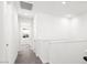 Upstairs hallway features neutral carpet, white walls, and minimalist design at 1485 Melodic Lark Ln, Las Vegas, NV 89138