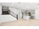Open-concept kitchen featuring an island, stainless steel appliances, and modern gray cabinetry at 1485 Melodic Lark Ln, Las Vegas, NV 89138