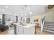 Bright, open-concept kitchen featuring a large island, pendant lighting, and modern appliances at 1485 Melodic Lark Ln, Las Vegas, NV 89138