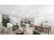 Bright, open-concept living room with sleek finishes, modern furniture, and a staircase at 1485 Melodic Lark Ln, Las Vegas, NV 89138