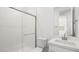 Bright white bathroom featuring a shower, modern vanity, and sleek fixtures at 1491 Melodic Lark Dr, Las Vegas, NV 89138