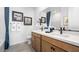 Stylish bathroom featuring a double vanity, framed mirrors, and contemporary fixtures at 1491 Melodic Lark Dr, Las Vegas, NV 89138