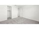 This bedroom has neutral colored carpet and walk in closet at 1491 Melodic Lark Dr, Las Vegas, NV 89138
