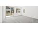 A bright bedroom with carpeted floors and large windows at 1491 Melodic Lark Dr, Las Vegas, NV 89138