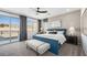 Serene bedroom with mountain views, a blue bedframe, and stylish accent bench at 1491 Melodic Lark Dr, Las Vegas, NV 89138