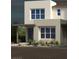 Modern home exterior with desert landscaping and stylish architectural details creating a welcoming curb appeal at 1491 Melodic Lark Dr, Las Vegas, NV 89138