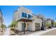 The exterior of this home features a blue door and desert landscape at 1491 Melodic Lark Dr, Las Vegas, NV 89138