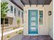 The attractive blue front door features glass panels and opens onto a brick paver landing and gravel walkway at 1491 Melodic Lark Dr, Las Vegas, NV 89138