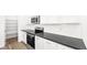 Bright modern kitchen features stainless steel appliances, white cabinets, and a pantry for ample storage at 1491 Melodic Lark Dr, Las Vegas, NV 89138