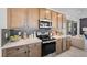 Well-equipped kitchen with stainless steel appliances and ample counter space for cooking at 1491 Melodic Lark Dr, Las Vegas, NV 89138