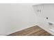 This laundry room has wood-look tile and hook ups for a washer and dryer at 1491 Melodic Lark Dr, Las Vegas, NV 89138