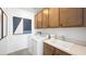 A well-equipped laundry room featuring modern appliances and ample storage for efficient chores at 1491 Melodic Lark Dr, Las Vegas, NV 89138