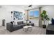 Bright living room showcasing mountain views, a comfortable sofa, and stylish decor at 1491 Melodic Lark Dr, Las Vegas, NV 89138