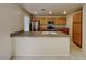 Bright kitchen featuring a large island, stainless steel appliances, and ample cabinet space at 2132 Tierra Del Verde St, Las Vegas, NV 89156