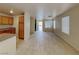 Open living space with tiled flooring, recessed lighting, and connection to the kitchen area at 2132 Tierra Del Verde St, Las Vegas, NV 89156