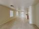 Spacious living room with tile floors, recessed lighting, and a sliding glass door at 2132 Tierra Del Verde St, Las Vegas, NV 89156