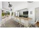 Outdoor bar with seating, granite countertop, TV, and shade with views of tropical landscaping at 222 Karen Ave # 3305, Las Vegas, NV 89109