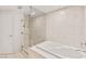 Contemporary bathroom features a glass-enclosed shower with a soaking tub at 222 Karen Ave # 3305, Las Vegas, NV 89109