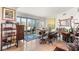 Dining area with a rustic table, seating, and balcony access with city views at 222 Karen Ave # 3305, Las Vegas, NV 89109