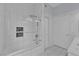 Modern bathroom with glass enclosed tub-shower featuring white tile surround at 2305 W Horizon Ridge Pkwy # 611, Henderson, NV 89052