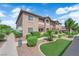 Well maintained exterior featuring lush landscaping, pet waste station, and convenient sidewalk access, offering a welcoming community vibe at 2305 W Horizon Ridge Pkwy # 611, Henderson, NV 89052