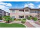 Inviting exterior with landscaped grounds, beige stucco, private balconies, and covered entryways, providing great curb appeal at 2305 W Horizon Ridge Pkwy # 611, Henderson, NV 89052