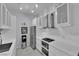A contemporary kitchen with stainless steel appliances, sleek white cabinetry, and modern fixtures at 2305 W Horizon Ridge Pkwy # 611, Henderson, NV 89052