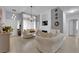 Bright living room with neutral tones, elegant lighting, and a cozy fireplace, perfect for relaxation and entertaining at 2305 W Horizon Ridge Pkwy # 611, Henderson, NV 89052