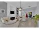 Modern open concept living room featuring stylish furnishings, a cozy fireplace, and seamless flow to the dining area at 2305 W Horizon Ridge Pkwy # 611, Henderson, NV 89052