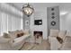 Comfortable living space with chic decor, a modern fireplace, and abundant natural light, creating a serene ambiance at 2305 W Horizon Ridge Pkwy # 611, Henderson, NV 89052