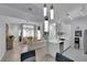 Bright living room featuring modern lighting, hardwood floors, and a cozy seating area at 2305 W Horizon Ridge Pkwy # 611, Henderson, NV 89052