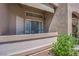 Cozy outdoor patio with a small seating area, privacy, and access to the outside at 2305 W Horizon Ridge Pkwy # 611, Henderson, NV 89052