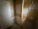 Bathroom with a tub and tiled walls, ready for renovation and modern updates at 2451 E Falcon St, Pahrump, NV 89048