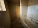 Bathroom with a tub and tiled wall, ready for remodeling to create a spa-like experience at 2451 E Falcon St, Pahrump, NV 89048