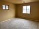Empty bedroom with two windows, awaiting new finishes and personal touches at 2451 E Falcon St, Pahrump, NV 89048