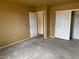 Bedroom with open closet and doorway, ready for transformation and personalization at 2451 E Falcon St, Pahrump, NV 89048