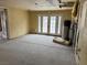 Large living room area with French doors leading to the backyard, featuring unfinished walls at 2451 E Falcon St, Pahrump, NV 89048